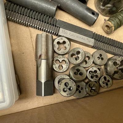 Flat Box full of very small drill bits/threading tools