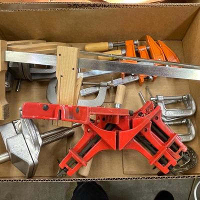 Box of small woodworking clamps