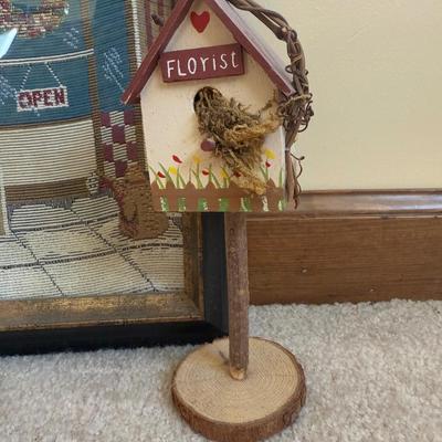 LOT 21B: Charlene Olson Embroidered Artwork, Florist Village House, Wreath in Box & More