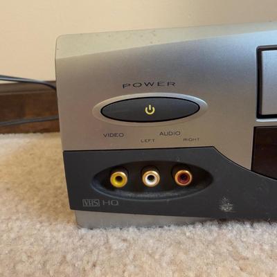 LOT 29B: RCA VCR Model No VR651HF w/ Collection of Disney VHS Tapes