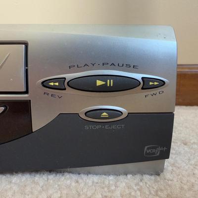 LOT 29B: RCA VCR Model No VR651HF w/ Collection of Disney VHS Tapes