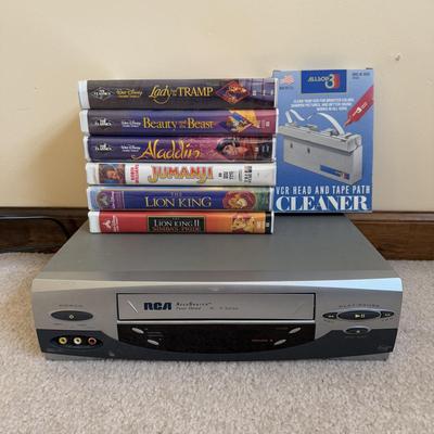 LOT 29B: RCA VCR Model No VR651HF w/ Collection of Disney VHS Tapes