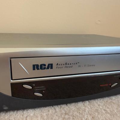 LOT 29B: RCA VCR Model No VR651HF w/ Collection of Disney VHS Tapes