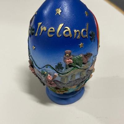 Metal camel ashtray from Jerusalem and Ireland egg with leprechaun inside
