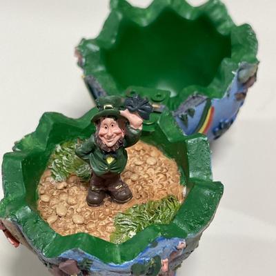 Metal camel ashtray from Jerusalem and Ireland egg with leprechaun inside