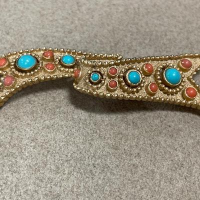 Purple rhinestone brooch, and Trifari, gold tone brooch