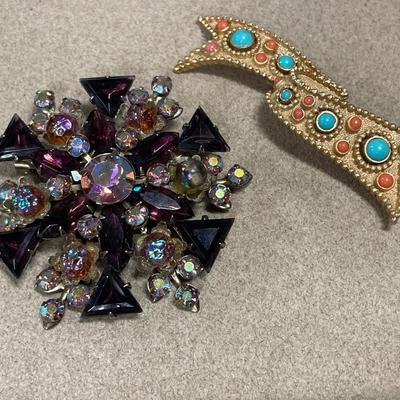 Purple rhinestone brooch, and Trifari, gold tone brooch