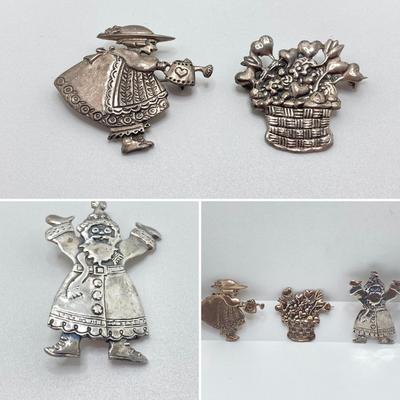 LOT 52: Sterling Mary Engelbreit Hearts in Basket Brooch, "Bloom" Girl with Water Can Brooch and Santa Claus Pin (MEINK)