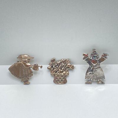 LOT 52: Sterling Mary Engelbreit Hearts in Basket Brooch, "Bloom" Girl with Water Can Brooch and Santa Claus Pin (MEINK)