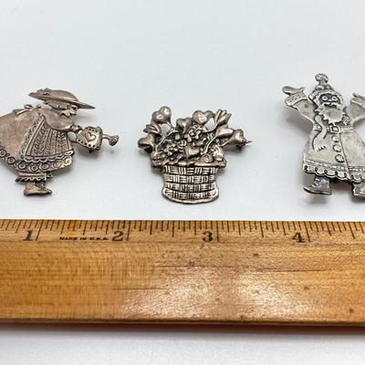 LOT 52: Sterling Mary Engelbreit Hearts in Basket Brooch, "Bloom" Girl with Water Can Brooch and Santa Claus Pin (MEINK)