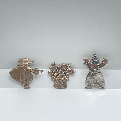 LOT 52: Sterling Mary Engelbreit Hearts in Basket Brooch, "Bloom" Girl with Water Can Brooch and Santa Claus Pin (MEINK)