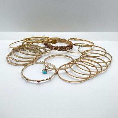 LOT 115: Collection of Gold Tone Bangle Bracelets