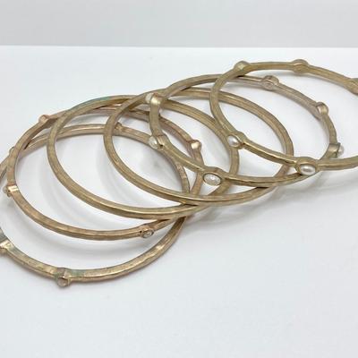LOT 115: Collection of Gold Tone Bangle Bracelets