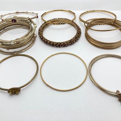 LOT 115: Collection of Gold Tone Bangle Bracelets