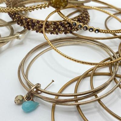 LOT 115: Collection of Gold Tone Bangle Bracelets