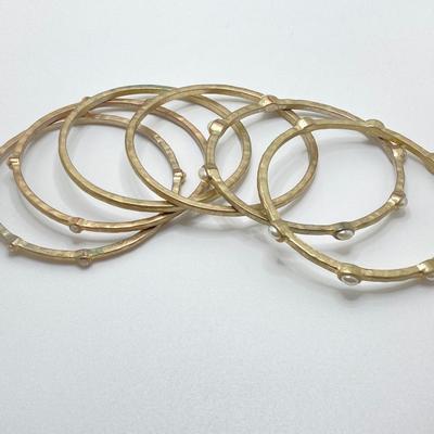 LOT 115: Collection of Gold Tone Bangle Bracelets