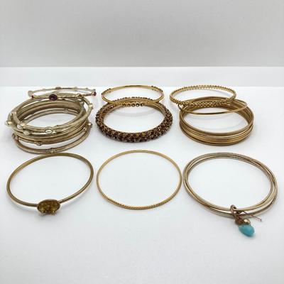 LOT 115: Collection of Gold Tone Bangle Bracelets