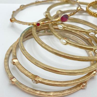LOT 115: Collection of Gold Tone Bangle Bracelets