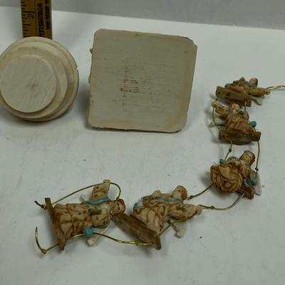 An Angel Lot- Angel upon column trinket box and sting of resin angel figurines