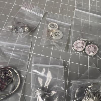 10 Pair of Silver Toned Pretty Earrings. 