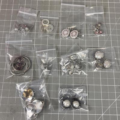10 Pair of Silver Toned Pretty Earrings. 