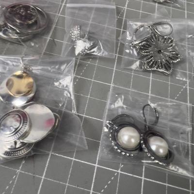 10 Pair of Silver Toned Pretty Earrings. 