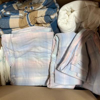 Box of tablecloths, pillowcases and sheets