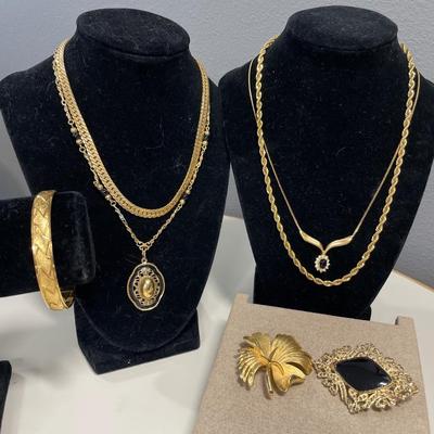 Black and gold tone jewelry