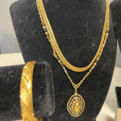 Black and gold tone jewelry