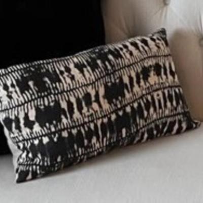 Two small black and white Southwestern style decorative pillows