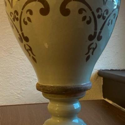 Wooden hanging basket, a small black planter with honeycomb design, 2 small metal planters and one taller decorative planter