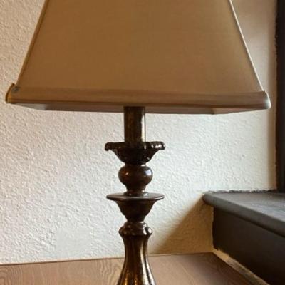 Bring some softness into your bedroom with a super soft husband, a cloth red and white clothes basket and a elegant table