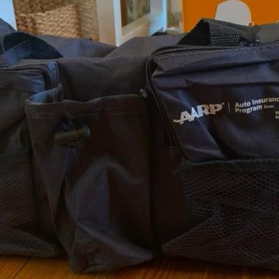 Marmot backpack, a Qbic backpack, AARP gym bag and an Asheville Trail Guide!