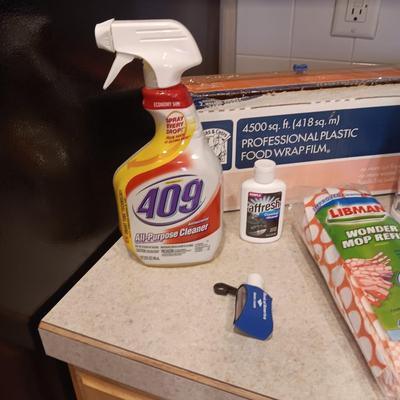 CLEANING PRODUCTS, LARGE ROLL OF PLASTIC WRAP AND BROOM WITH DUST PAN