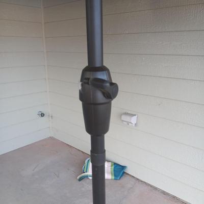 LIKE NEW PATIO UMBRELLA WITH METAL STAND
