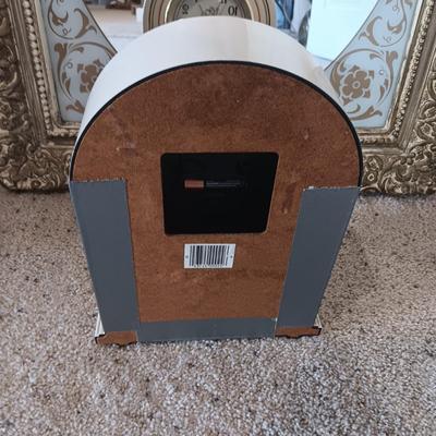 ELGIN CLOCK AND A PLASTIC FRAMED WALL MIRROR
