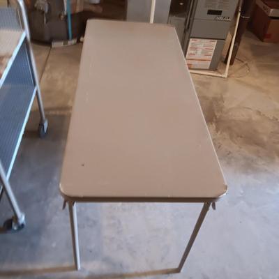 2 TIER LIBRARY CART ON WHEELS AND A 4 FOOT FOLDING TABLE
