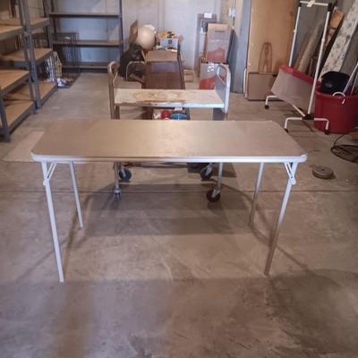 2 TIER LIBRARY CART ON WHEELS AND A 4 FOOT FOLDING TABLE