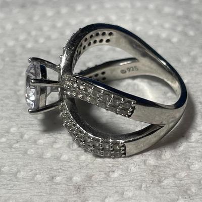 VINTAGE PREOWNED STERLING SILVER CZ ENGAGEMENT STYLE RING SIZE-8 IN VERY GOOD CONDITION. FREE DOMESTIC SHIPPING.