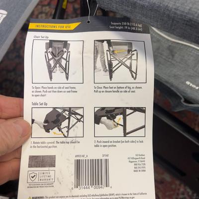 Pair of Rocker Chairs with Tags with A Shelf Too  