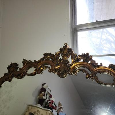 Gold framed mirror.