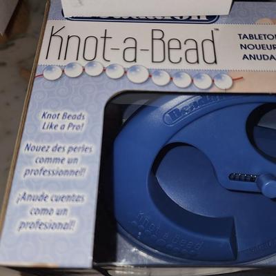Knot a bead in box