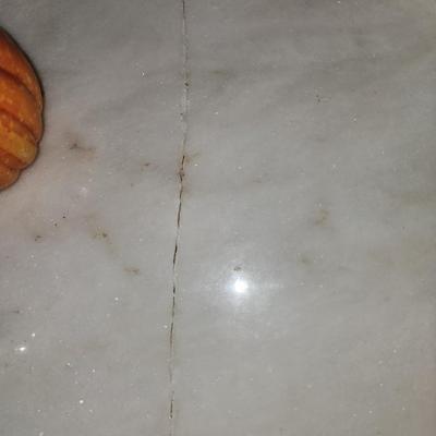 Pair of marble top end tables.