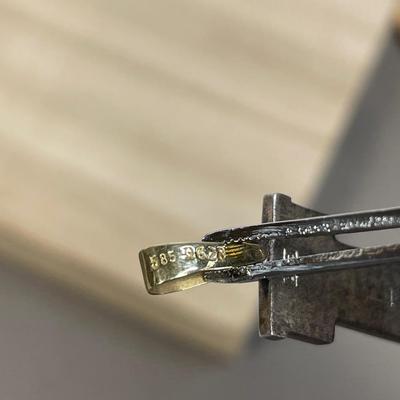 14K and 950 silver Egyptian cartouche spells “Linda”