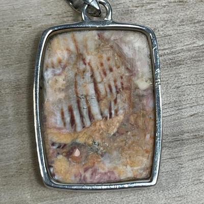 Lion’s Paw shell and sterling silver pendant