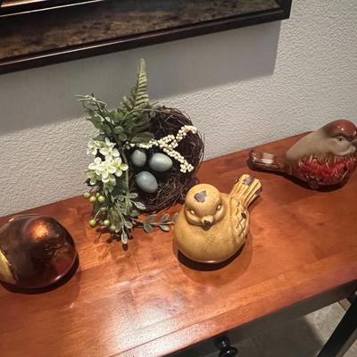 3 birds and a nest