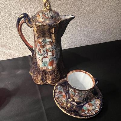 Tea pot and cup and saucer