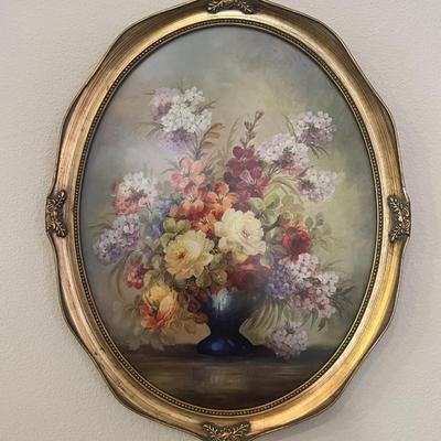 2 oval framed flower pictures