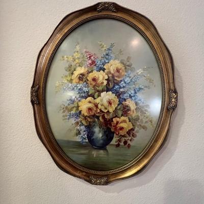 2 oval framed flower pictures