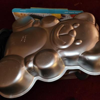 Lot of baking pans. Many shapes. About 15. Total.